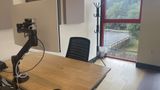 The dedicated desk in context on the upstairs floor, with neighbouring desks beyond