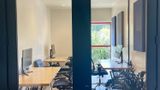Black glass doors leading in from the corridor