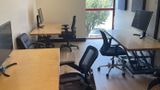 Workstations down both walls with the window at the end