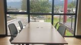 The four upstairs hotdesks pushed into a single block beside the windows