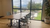 The upstairs hotdesk area, open seating with daylight on two sides