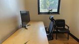 Desk and window from behind the task chair