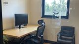 Room 208 marked by the door, desk and both chairs beyond