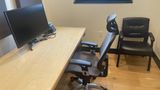 The desk and guest chair in Private Office 9, with daylight from the north-facing window