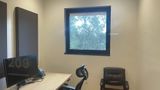 The monitor in Private Office 9 displaying the room number, 209