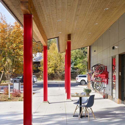 Covered patio with red steel columns