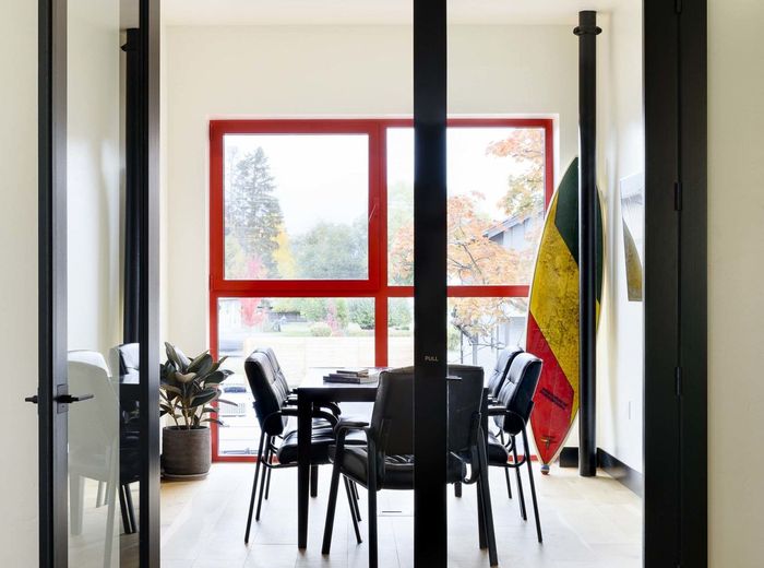 Full-height glass doors into the meeting room