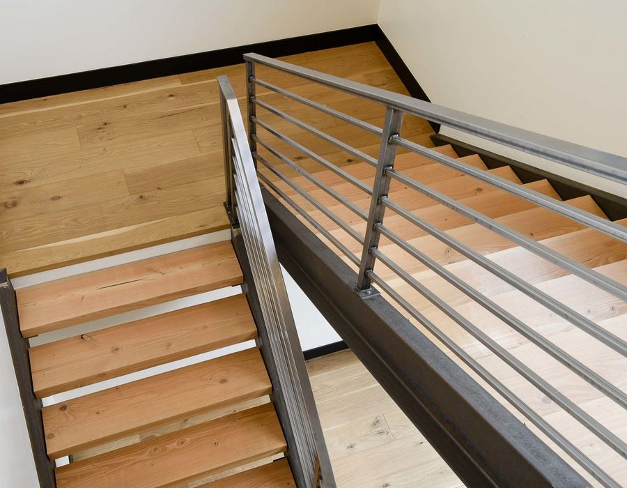 Wood and steel staircase connecting the two levels
